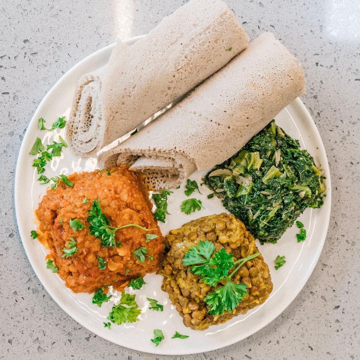 Traditional injera platter with assorted stews